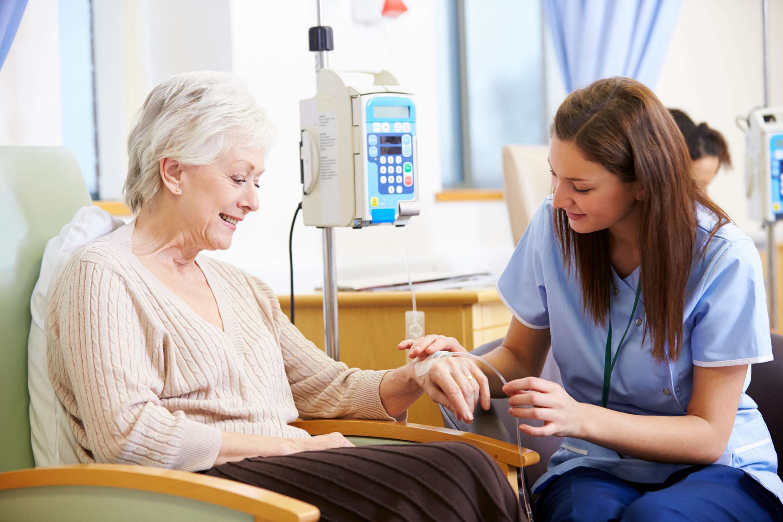 Patient receiving infusion therapy in a clinical treatment chair